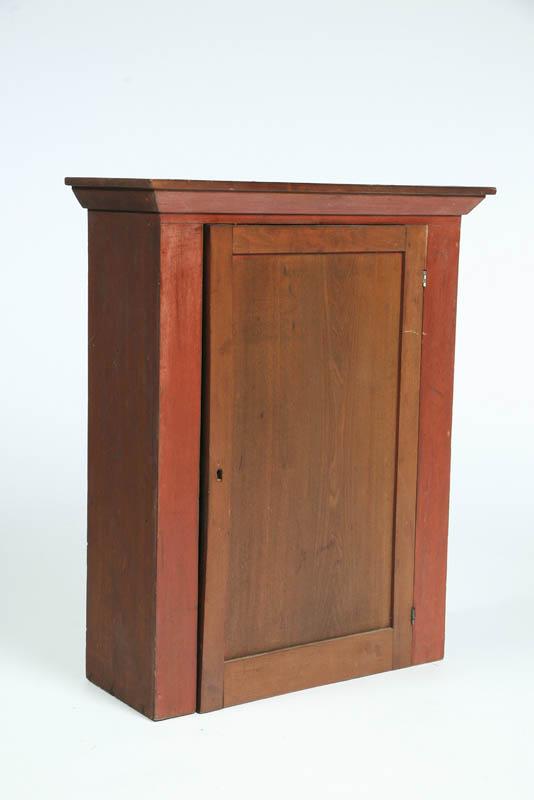 Appraisal: HANGING CUPBOARD Poplar with a molded cornice and single paneled