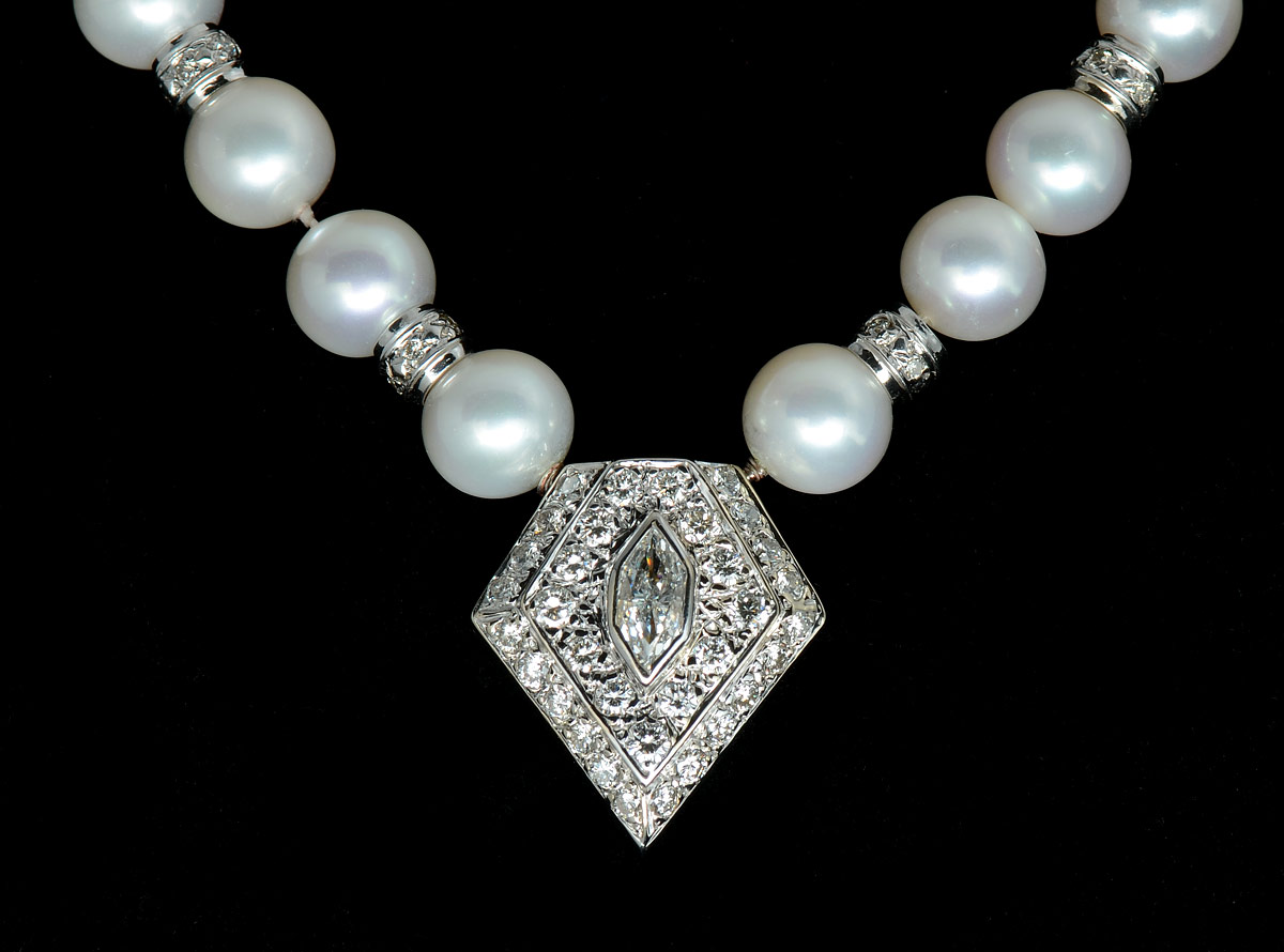 Appraisal: AKOYA PEARL AND DIAMOND NECKLACE k white gold spacers and