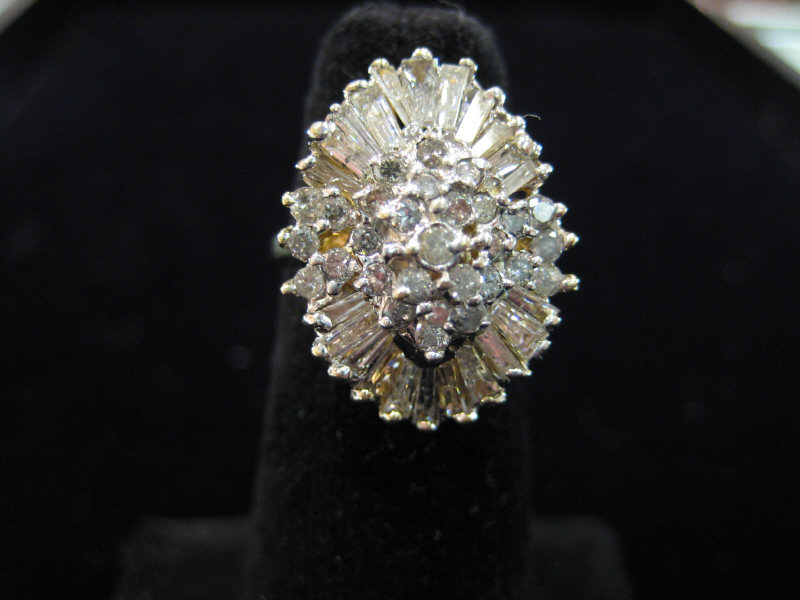 Appraisal: DIAMOND RING k yellow gold marquise shaped cluster ring set