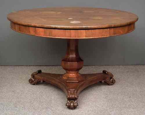 Appraisal: A William IV rosewood circular breakfast table fitted two frieze