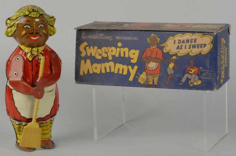 Appraisal: Tin Lindstrom Sweeping Mammy Wind-Up Toy Description Working Nice tin