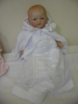 Appraisal: An Armand Marseille bisque head baby doll with brown glass