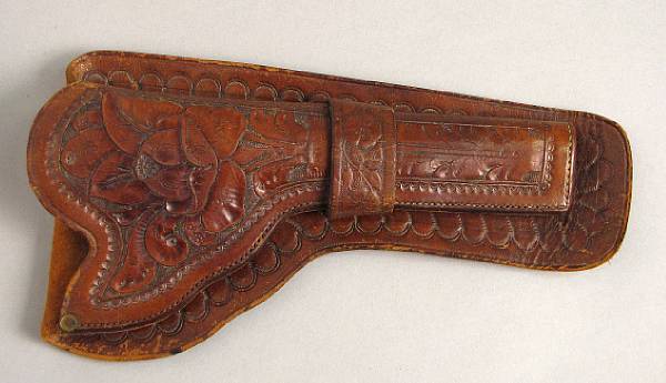 Appraisal: A single loop western holster The brown leather holster for