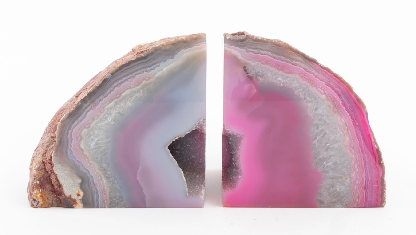 Appraisal: PINK BANDED AGATE GEODE BOOKENDS PAIR Pair of pink banded