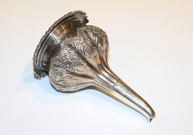 Appraisal: A GEORGE IV SILVER WINE FUNNEL with chased panels decorated