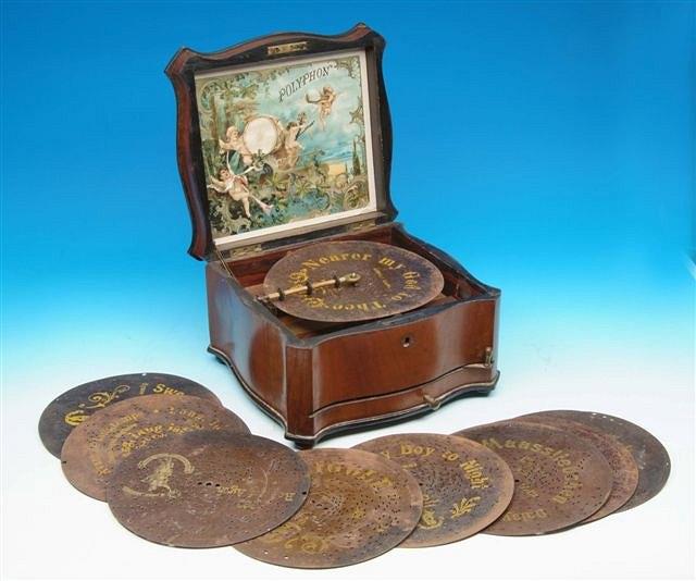 Appraisal: A CONTINENTAL WALNUT CASED POLYPHON with shaped case and winding