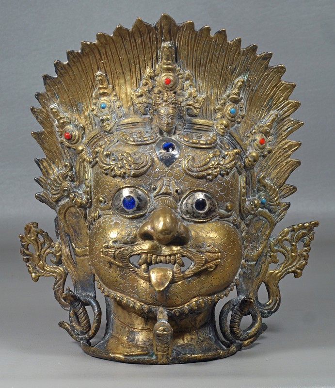 Appraisal: Tibetan Gilt Bronze Mask inlaid with coral and turquoise serpent