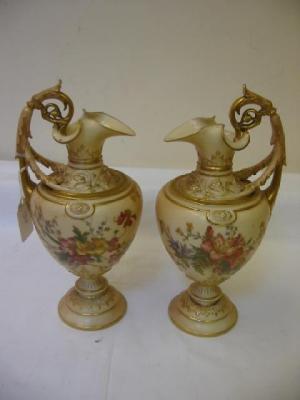 Appraisal: A PAIR OF ROYAL WORCESTER BLUSH PORCELAIN EWERS of ovoid