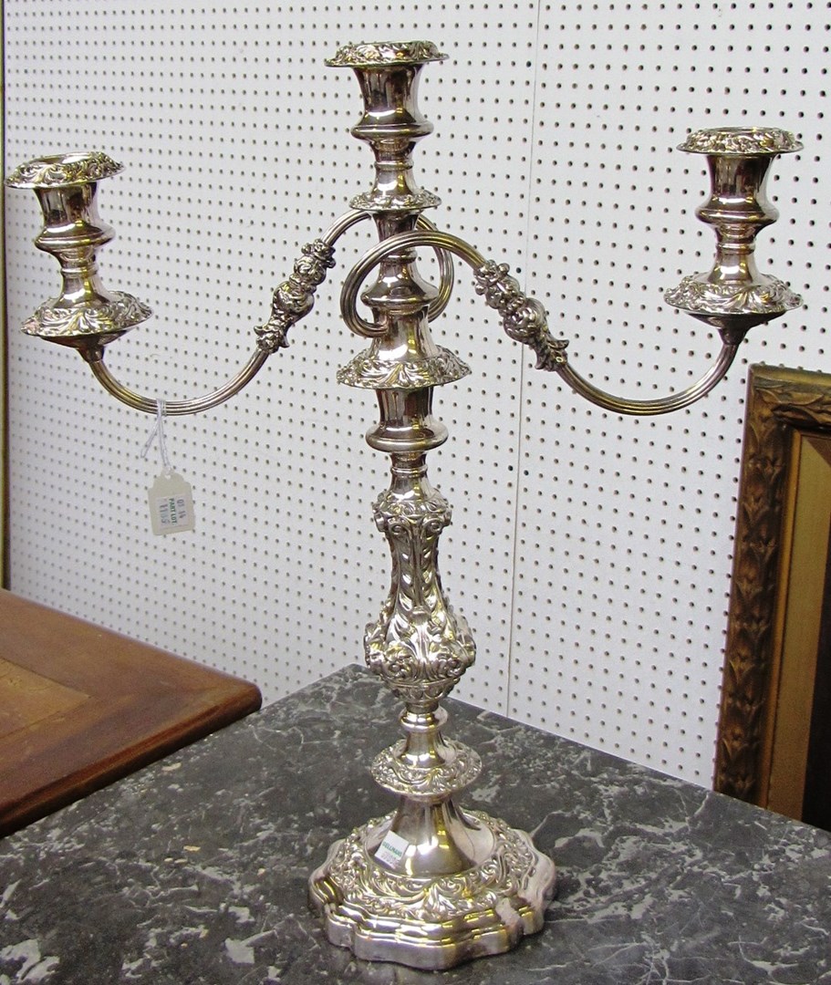 Appraisal: A pair of electro-plated on copper three light table candelabra