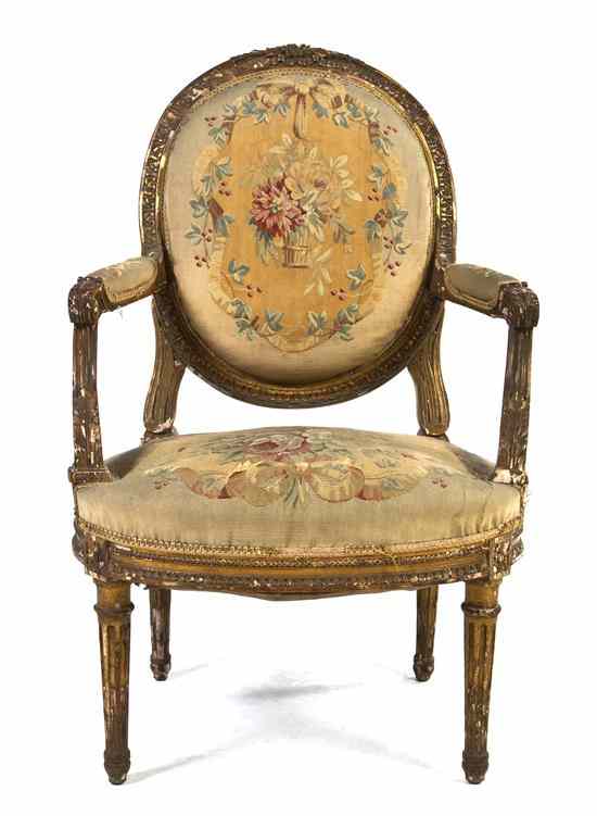 Appraisal: A Louis XVI Style Giltwood Fauteuil having a leaf carved