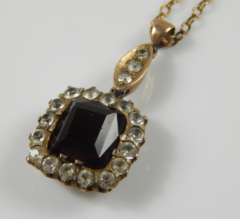 Appraisal: A pendant and chain in the Victorian style set with