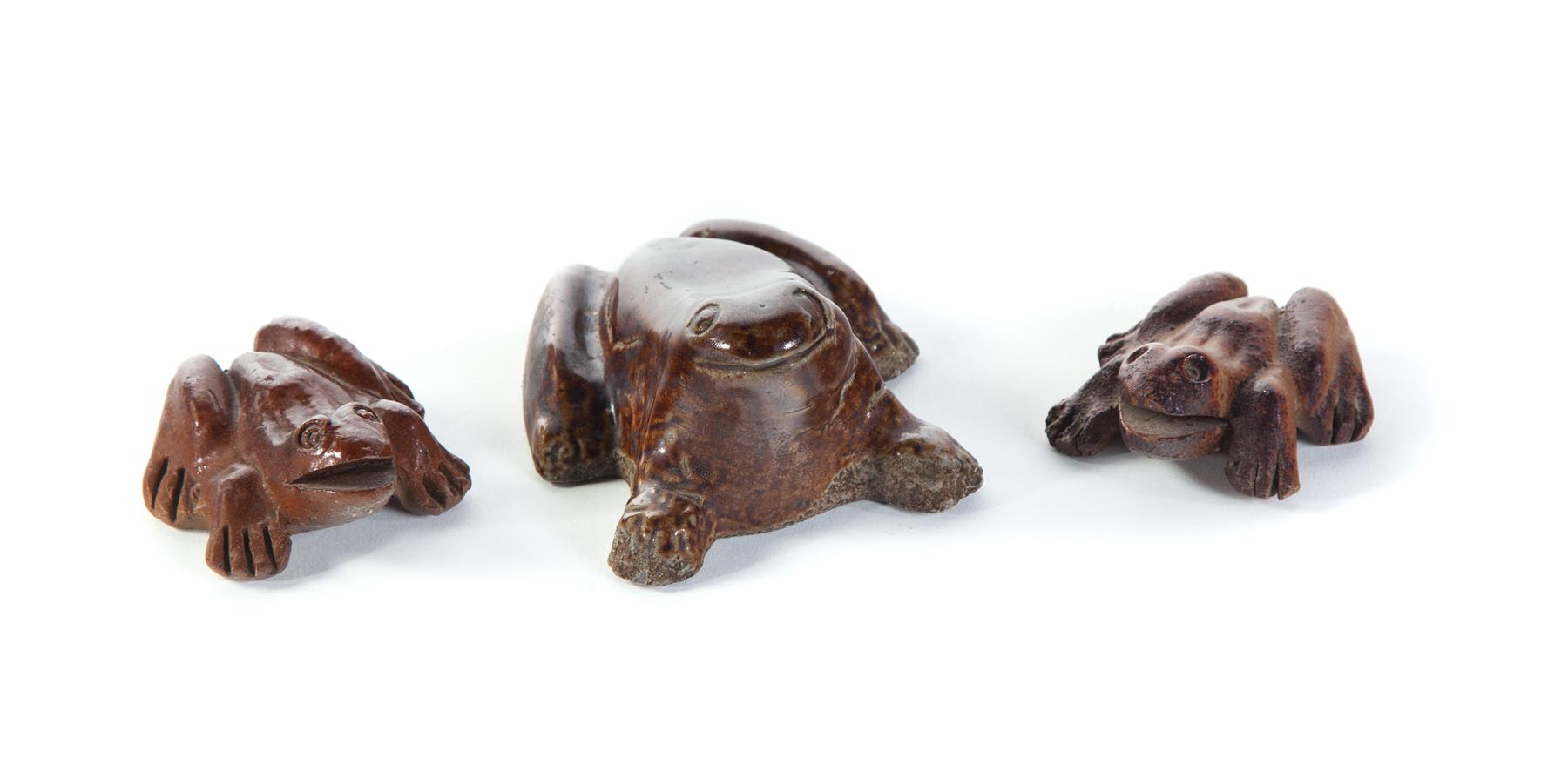 Appraisal: THREE AMERICAN SEWERTILE FROGS Mid th century Two marked What