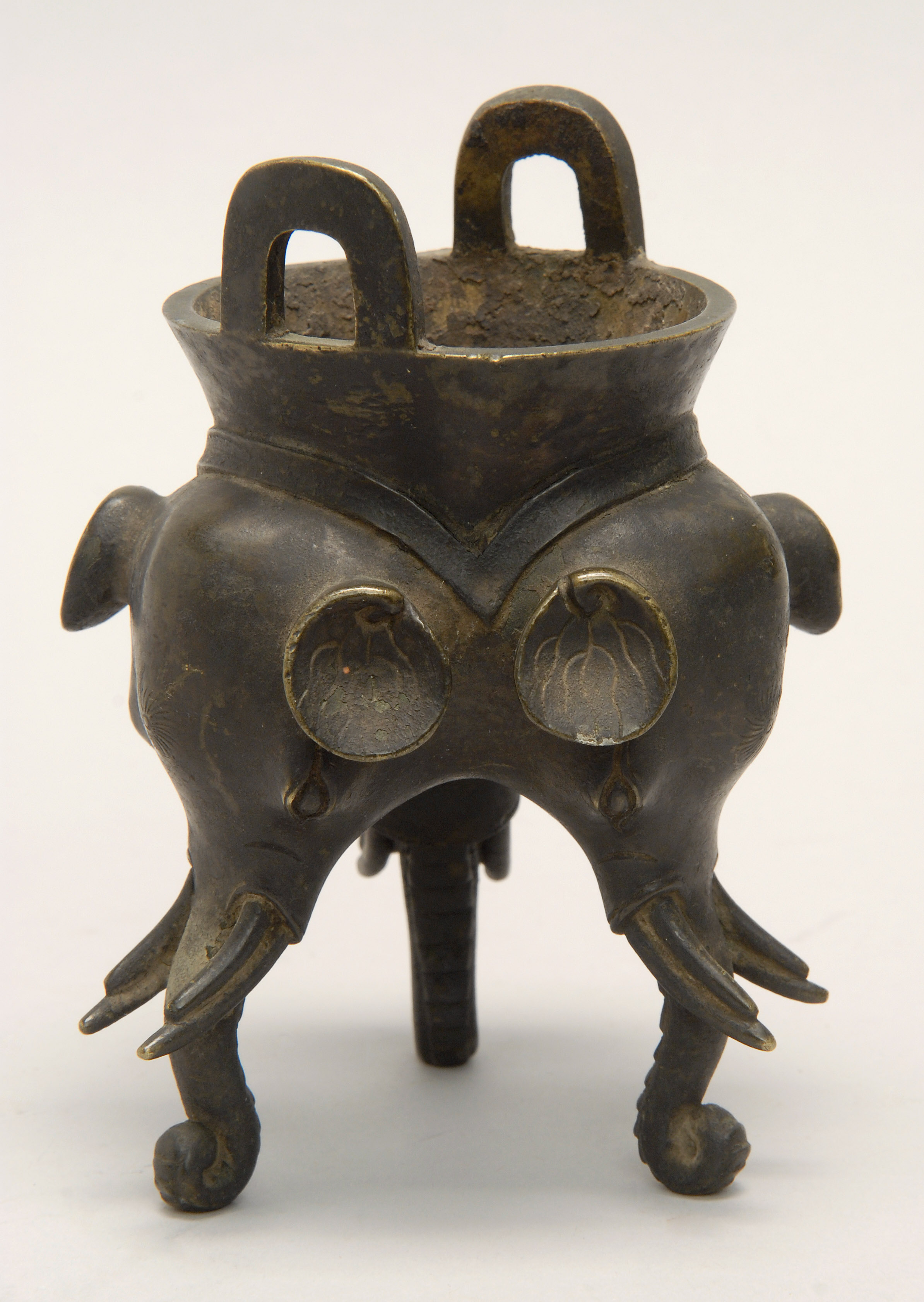 Appraisal: TRIPOD BRONZE CENSER th CenturyWith elephant's-head base and loop handles