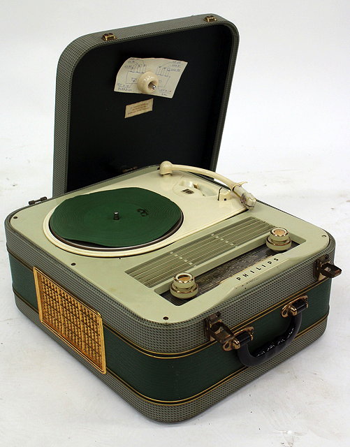 Appraisal: A COMBINATION GRAMOPHONE AND RADIO with a green upholstered and