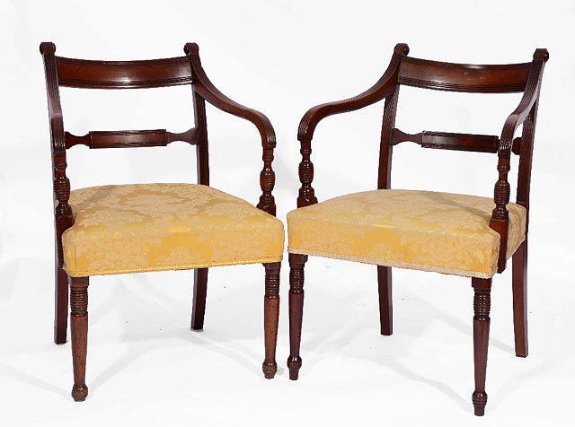 Appraisal: A PAIR OF GEORGE IV MAHOGANY ARMCHAIRS with horizontal reeded