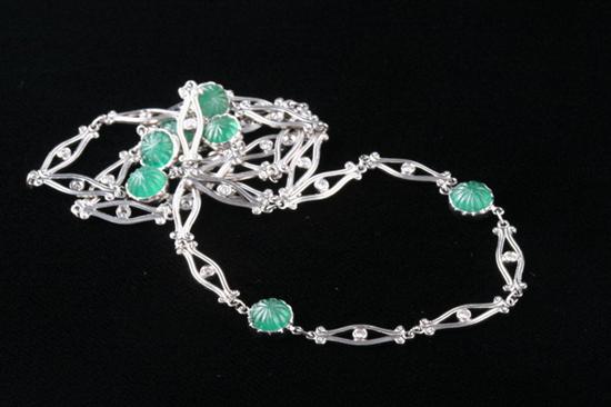 Appraisal: PLATINUM EMERALD AND DIAMOND NECKLACE Composed of seven carved emerald