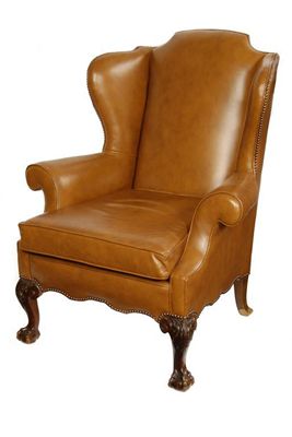 Appraisal: A George III style wing armchair on carved cabriole front