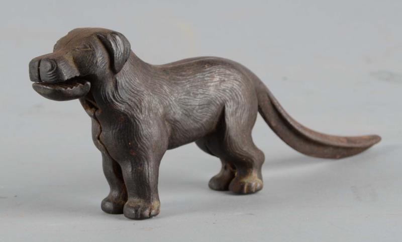 Appraisal: Mechanical Cast Metal Dog Nutcracker Lifting the tail opens the