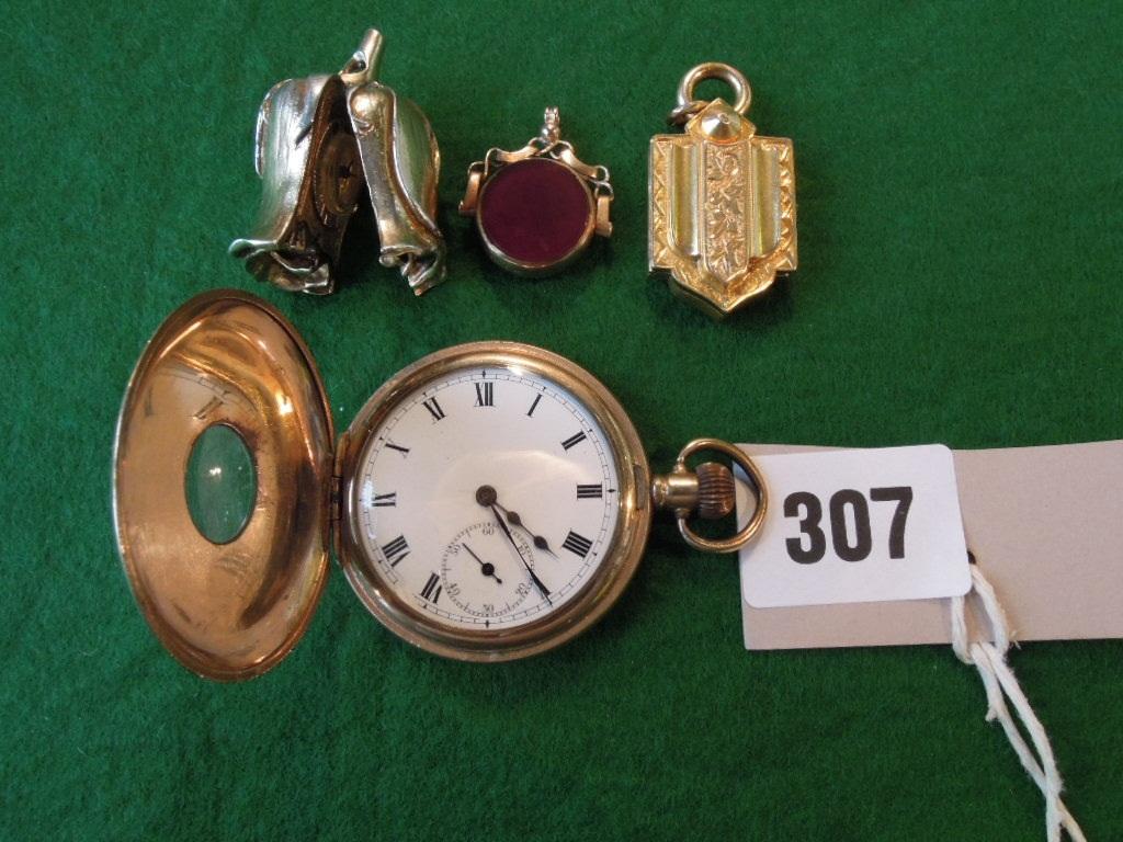 Appraisal: A gold plated half hunter pocket watch with Dennison case