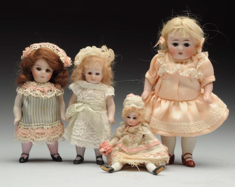 Appraisal: Lot Of German All-Bisque Dolls Largest incised with sleeping eyes