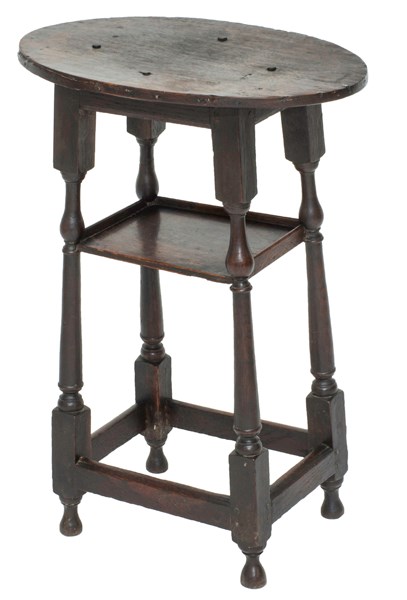 Appraisal: A th century oak two tier side table on baluster