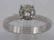 Appraisal: A white metal tests ct gold diamond solitaire ring the