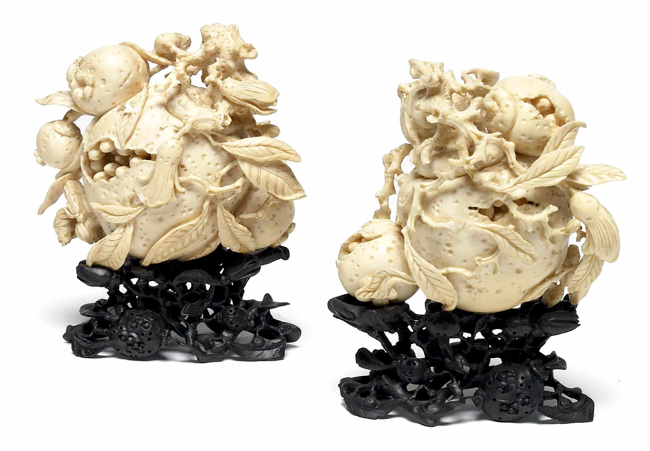 Appraisal: A group of two Chinese carved ivory pomegranate groups mid