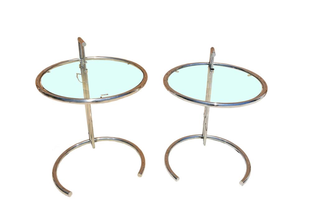 Appraisal: PAIR GLASS AND CHROME ADJUSTABLE SIDE TABLESThe circular top with