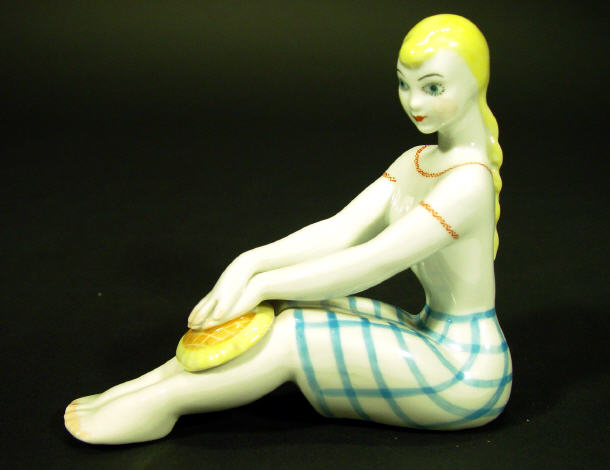 Appraisal: Hand painted Ukranian porcelain figurine a crouching 's style girl