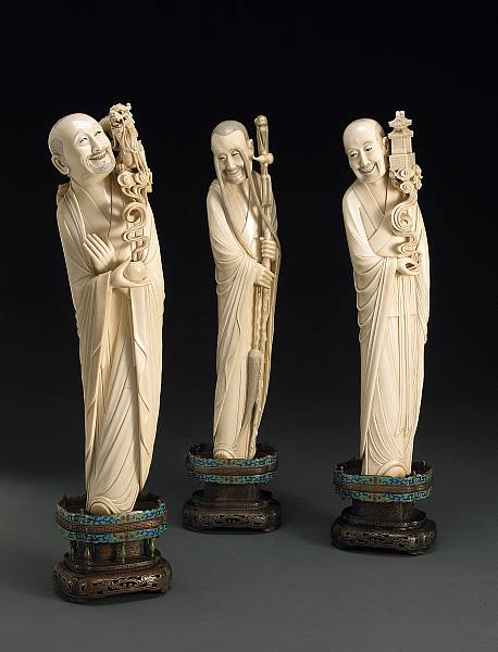 Appraisal: A set of three carved ivory luohan Late th Century