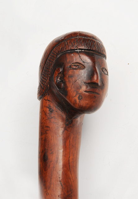 Appraisal: A SOUTH AMERICAN CARVED WOODEN TRIBAL STAFF with figure head