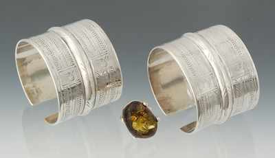 Appraisal: A Pair of Silver Cuff Bracelets and Amber Ring Silver