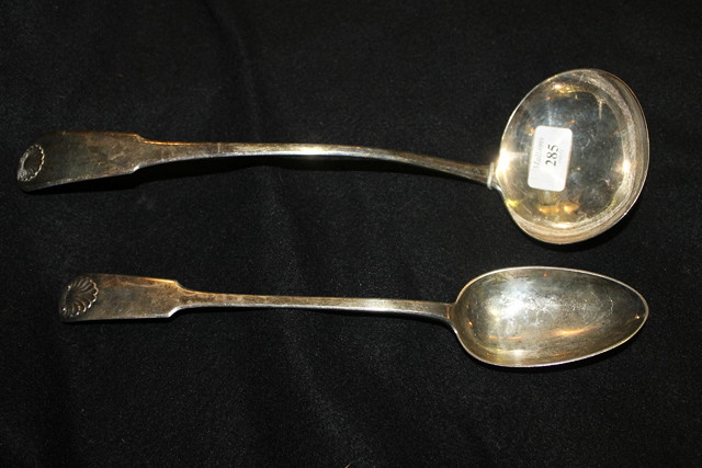 Appraisal: A SCOTTISH SHELL PATTERN LADLE Edinburgh together with a silver