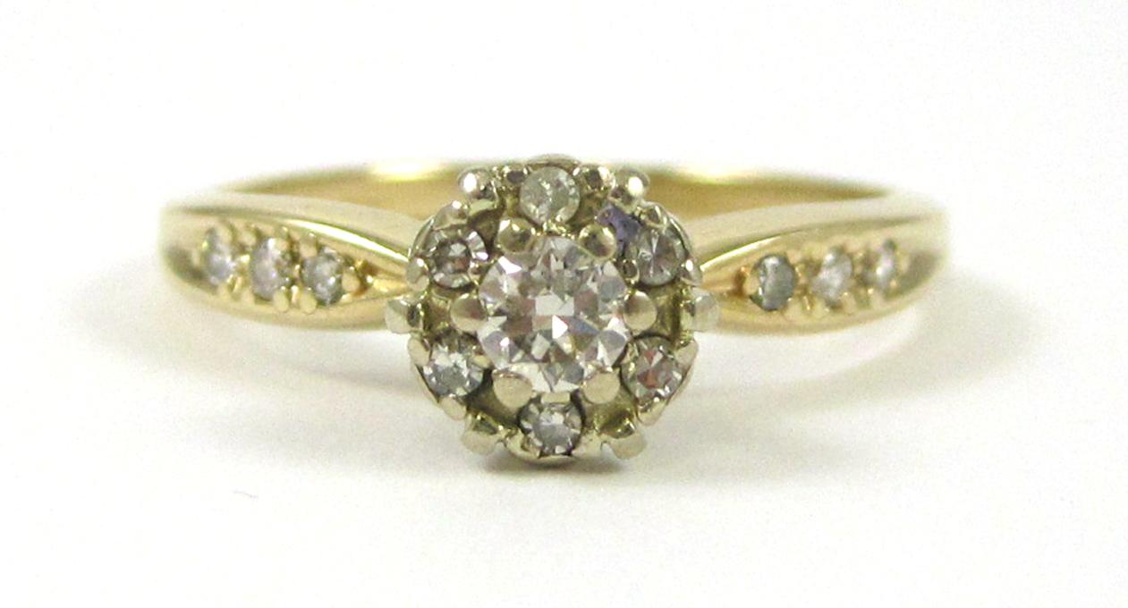 Appraisal: DIAMOND AND FOURTEEN KARAT GOLD RING set with round-cut diamonds