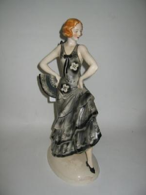 Appraisal: AN ART DECO POTTERY FIGURE in the Goldscheider style modelled