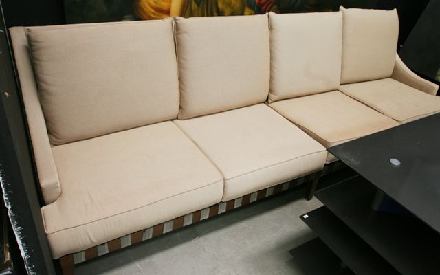 Appraisal: A contemporary fabric upholstered four seater sofa