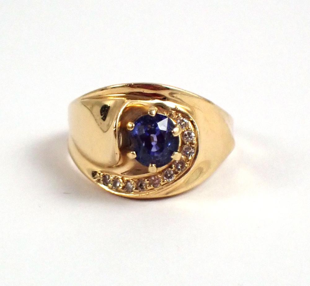 Appraisal: TANZANITE DIAMOND AND FOURTEEN KARAT GOLD RING centering an oval-cut