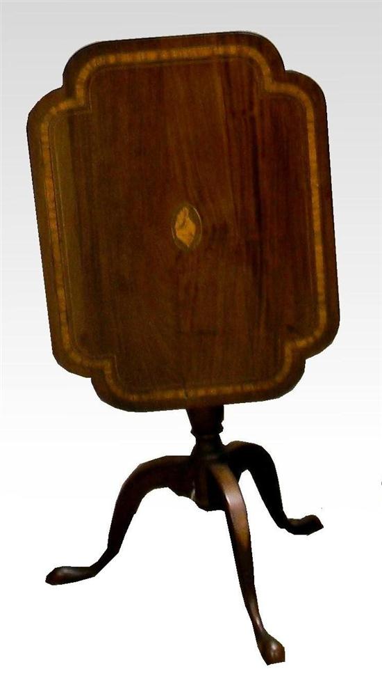 Appraisal: th C mahogangy tilt top candlestand with band inlay on