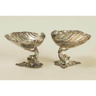 Appraisal: Two Nut Dishes Pair of dolphin footed clamshell nut dishes