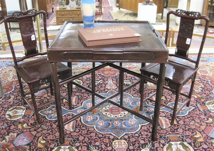 Appraisal: ROSEWOOD GAME TABLE AND CHAIR SET Chinese th century the