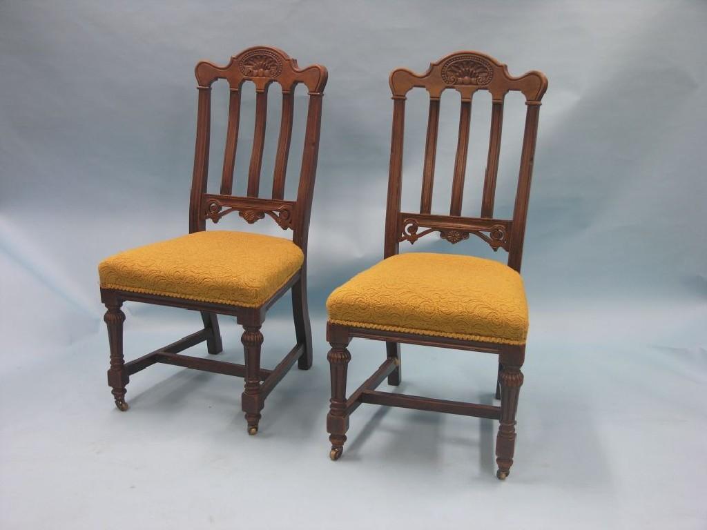 Appraisal: A set of six Victorian walnut dining chairs carved crestings