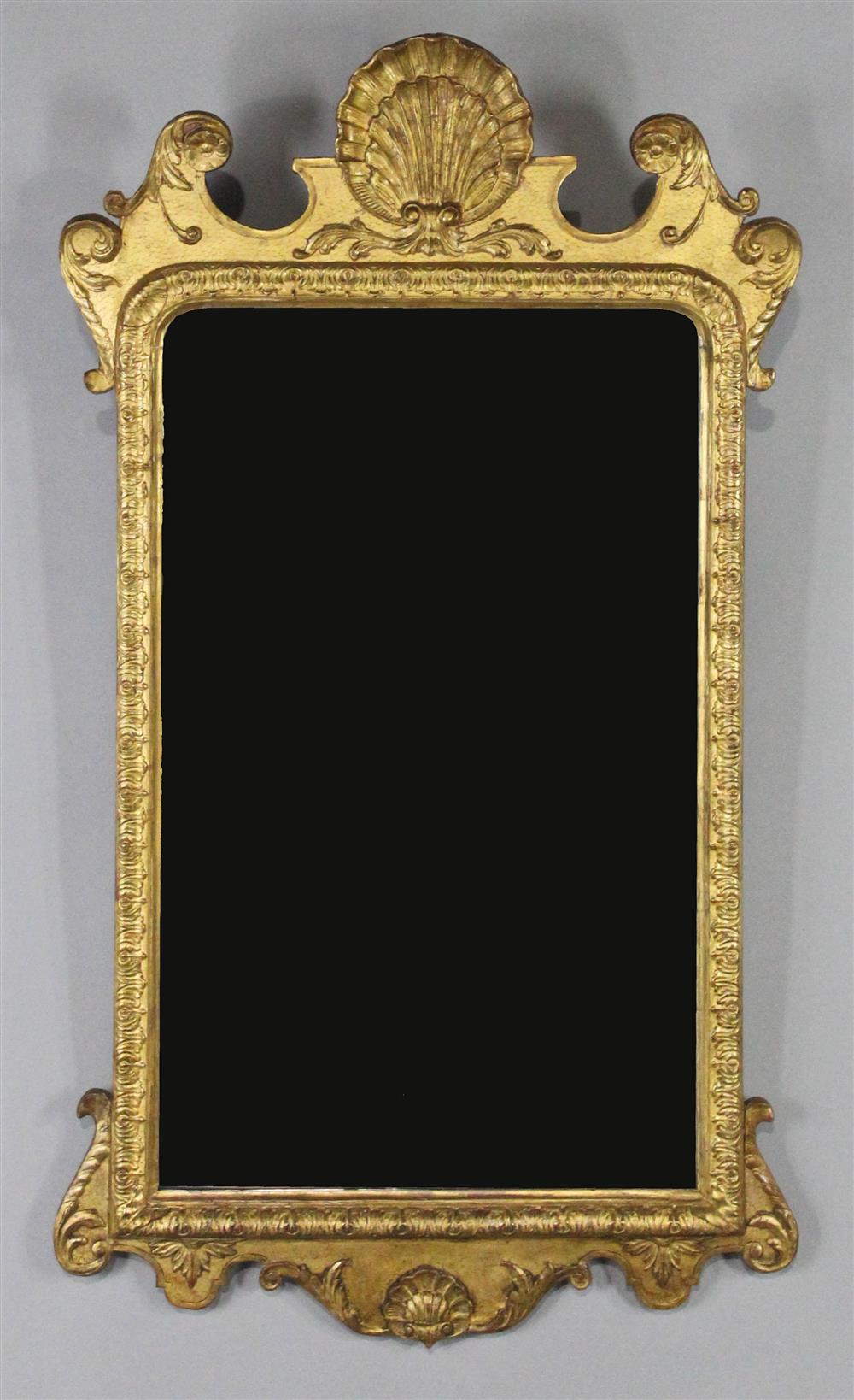 Appraisal: GEORGE II STYLE GILTWOOD MIRROR having a period gilded shell