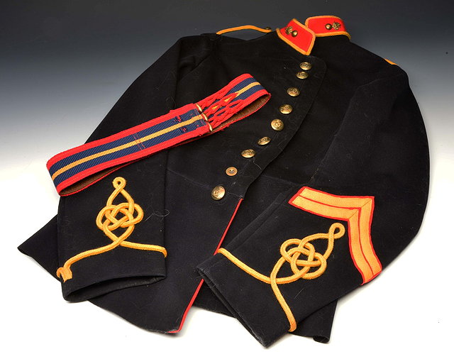 Appraisal: A ROYAL ARTILLERY REGIMENT DRESS JACKET with buttons and belt