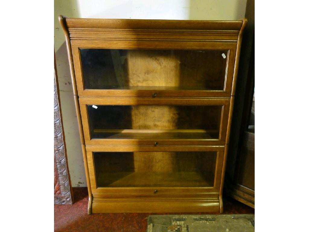 Appraisal: A Globe Wernicke style oak three sectional library bookcase enclosed