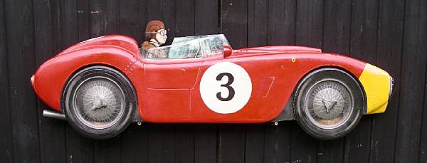 Appraisal: A hand-painted wooden profile of a Ferrari finished in red