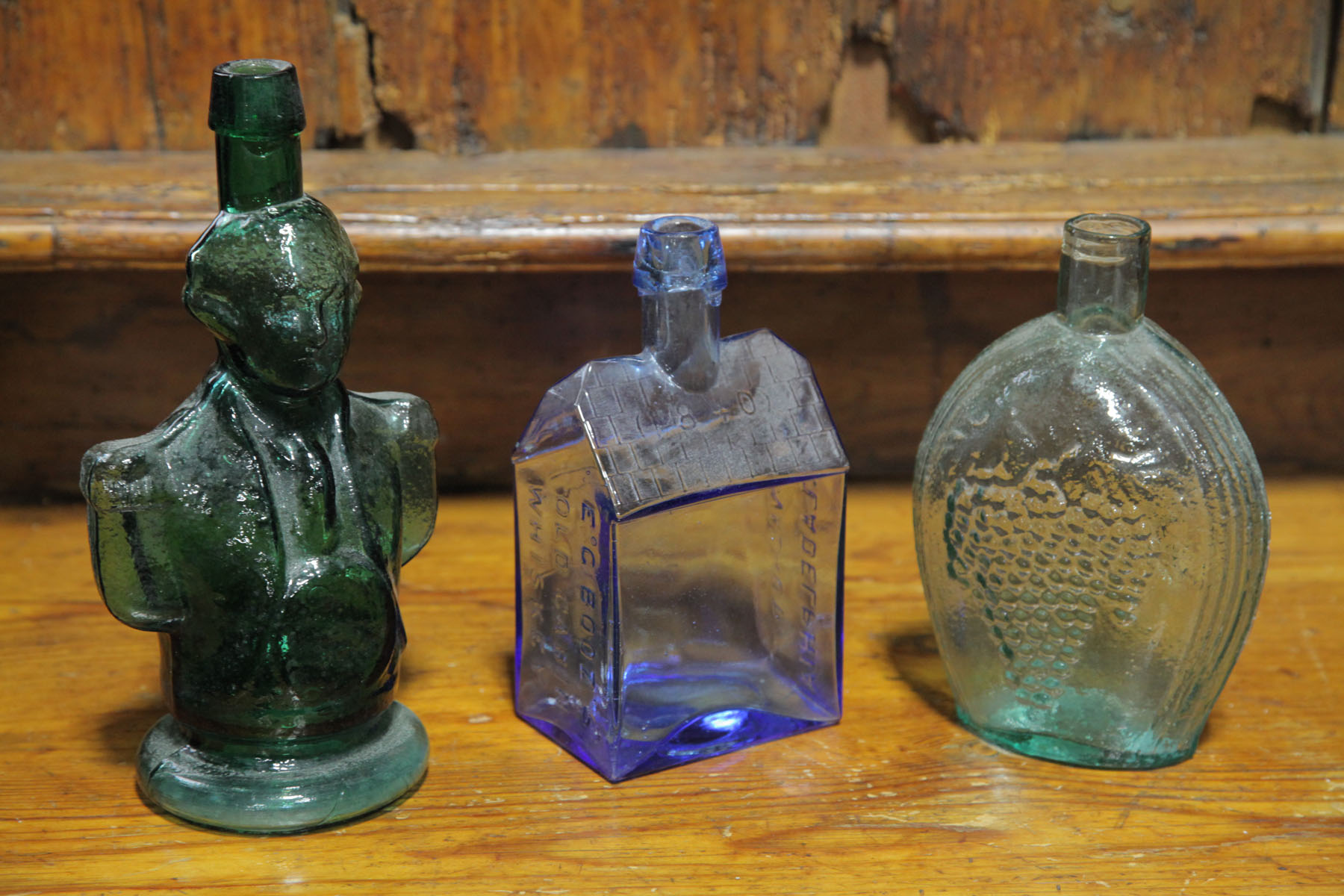 Appraisal: THREE BOTTLES American late th early th century All mold