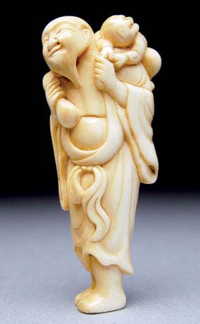 Appraisal: ANTIQUE IVORY NETSUKE Antique carved ivory netsuke of a tall