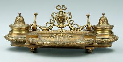 Appraisal: Brass inkstand two lidded inkwells lacking liners flanking oval cartouche