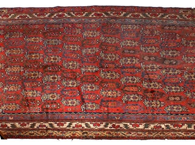 Appraisal: A SHIRAZ RED GROUND SMALL CARPET decorated an all over