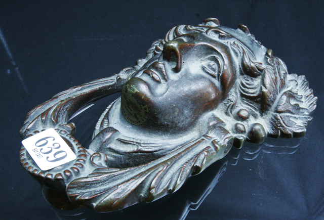 Appraisal: A bronze door knocker